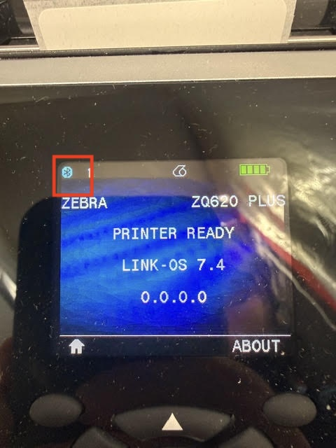 Zebra printer LCD reading PRINTER READY with the Bluetooth icon lit in the top-left status bar